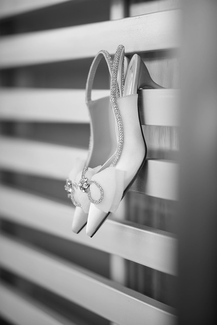 minimal bridal accessories with earrings and hair pins on champagne fabric